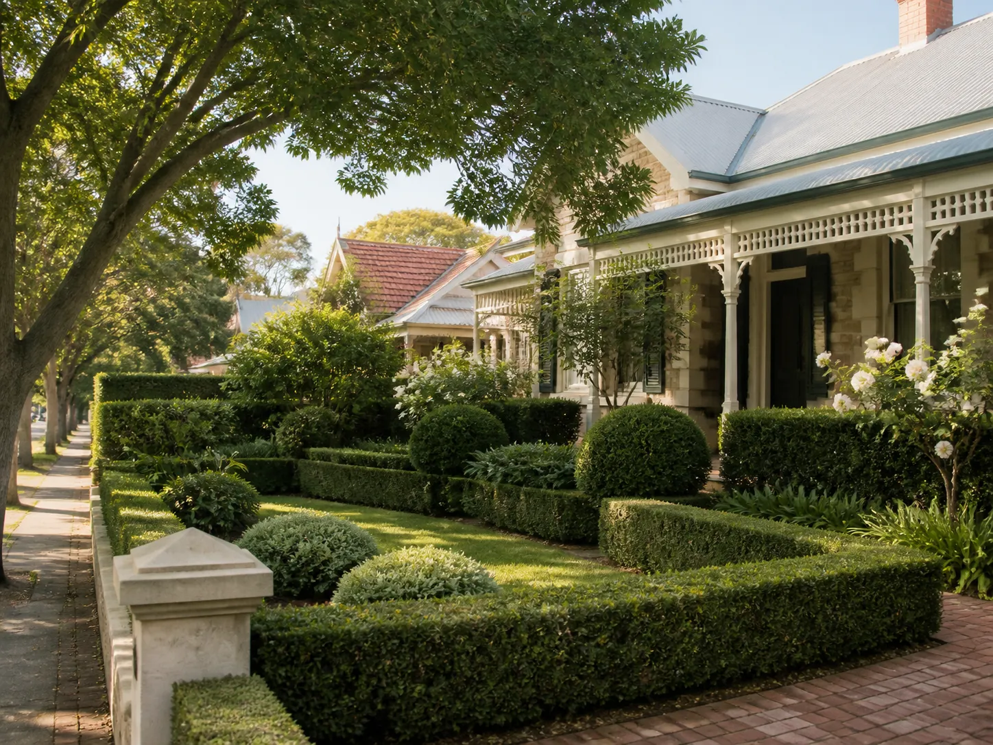 A heritage home in Perth's western suburbs with an established formal garden and clipped hedges.